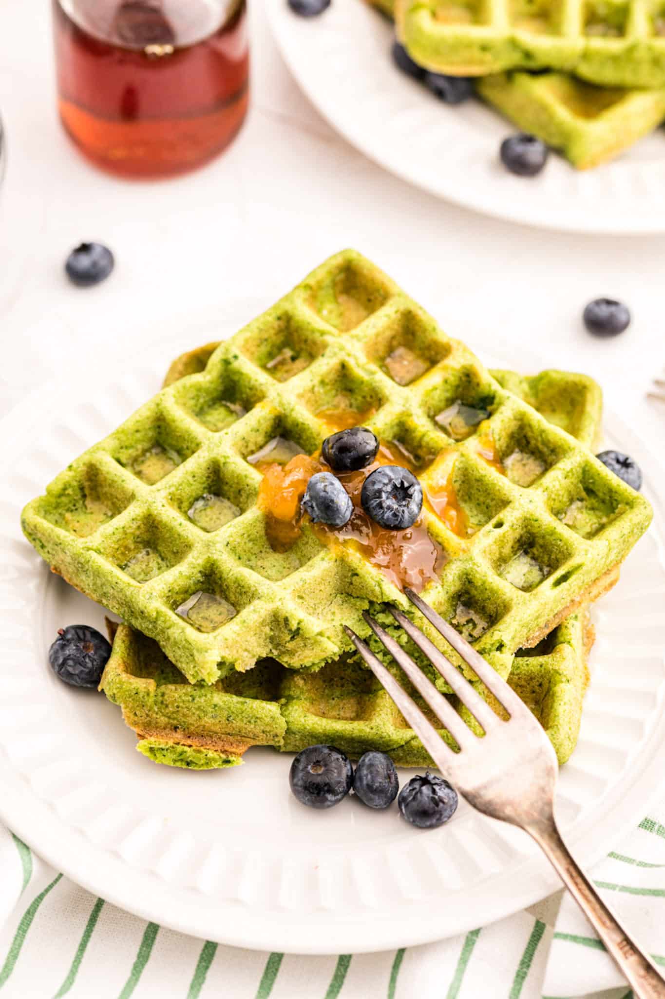 Green Waffles are a fun treat to serve for St. Patrick’s Day, Christmas, or Earth Day. Baby spinach adds color and is a sneaky way to add nutrition to this classic breakfast dish. Be sure to serve this fun and healthy green food to your loved ones. Everyone loves these healthy gluten-free waffles. 