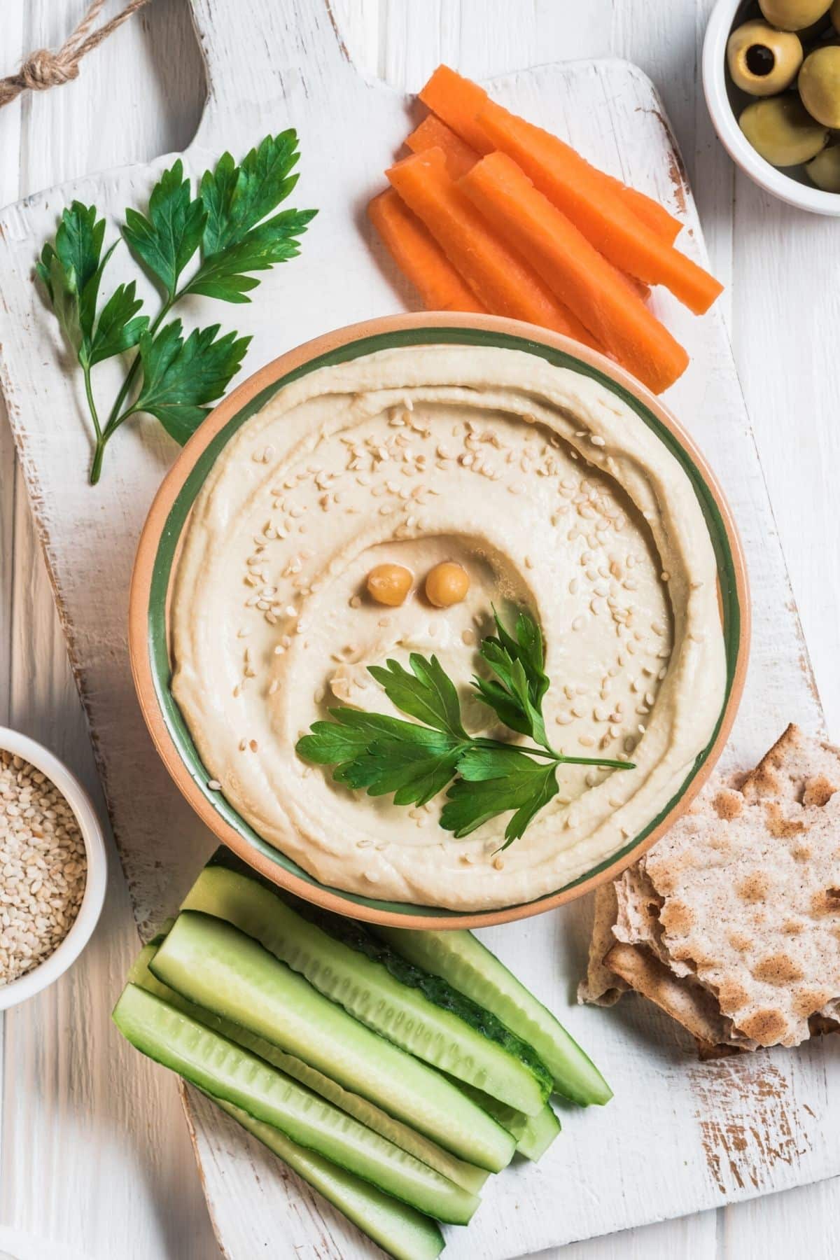 hummus with veggies and crackers.