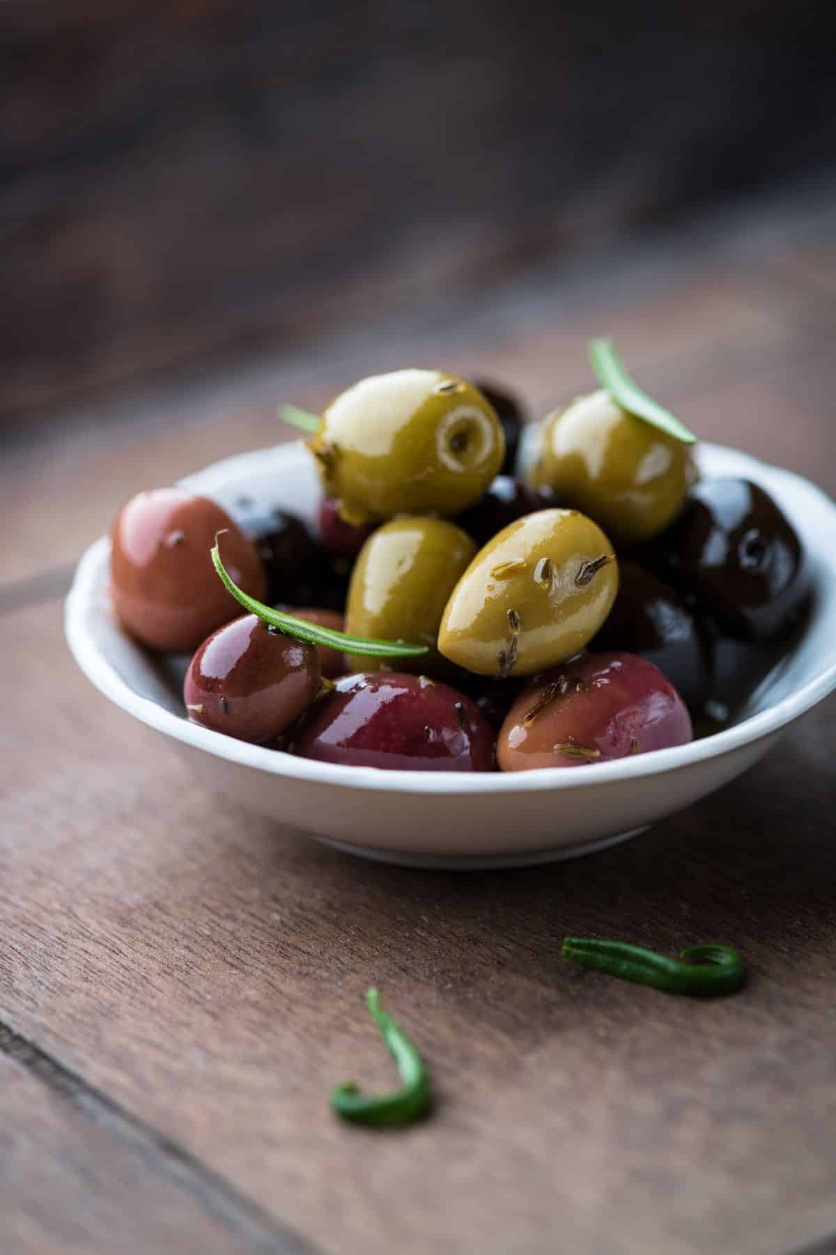 bowl of green, black, and brown olives.