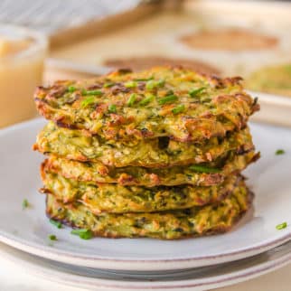 a stack of zucchini fritters on a plate.
