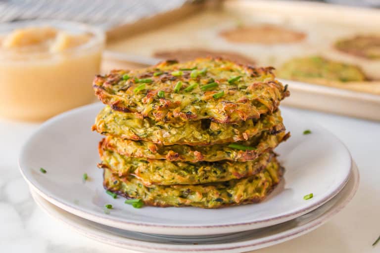 a stack of zucchini fritters on a plate.