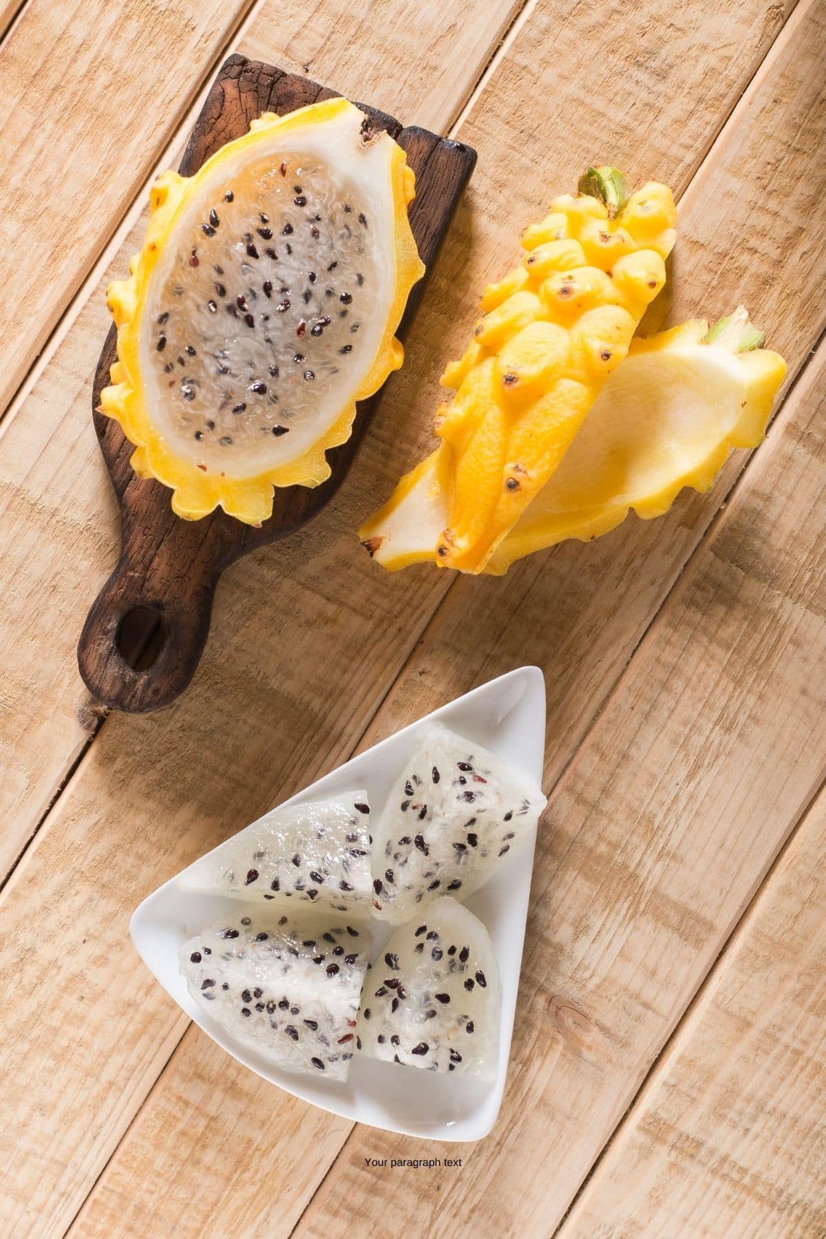 Yellow dragon fruit cut open on a table.