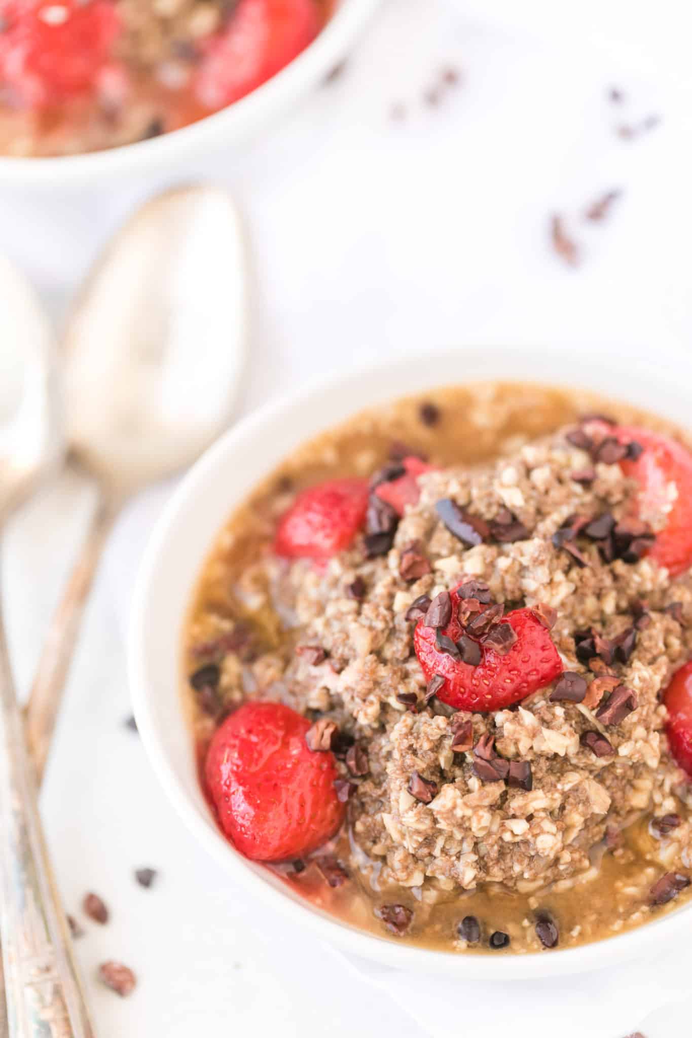 cauliflower oats served with strawberries and cacao nibs.