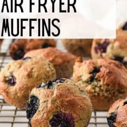 Gluten free blueberry mini muffins on a wire cooling rack.