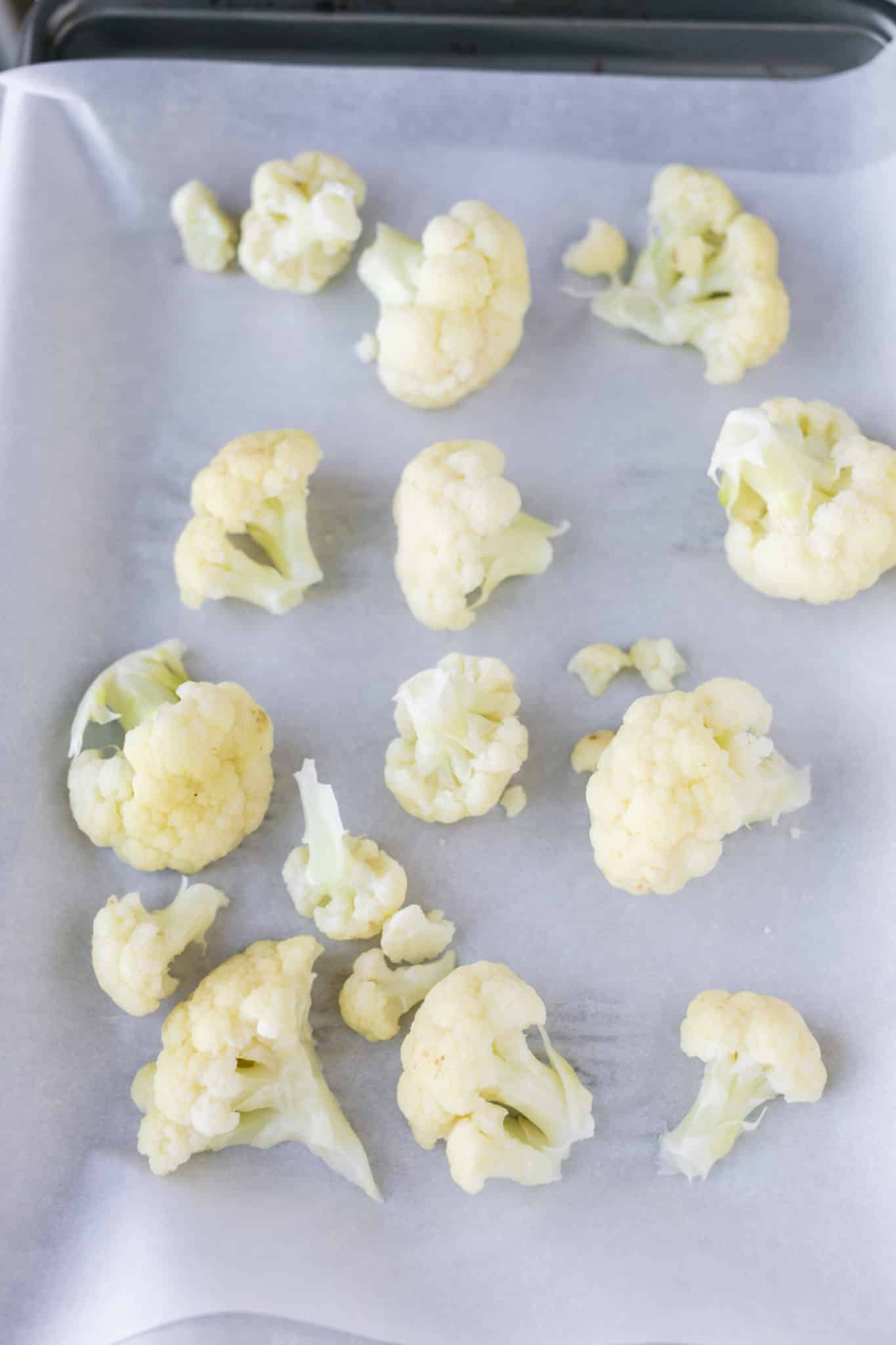 cauliflower on a baking sheet with parchment paper.