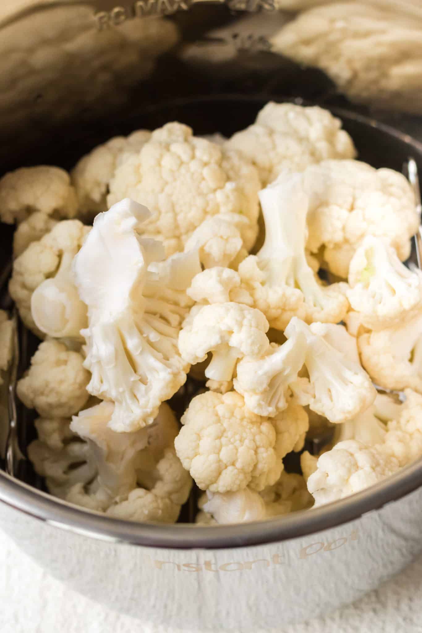 cauliflower florets inside of an instant pot pressure cooker.