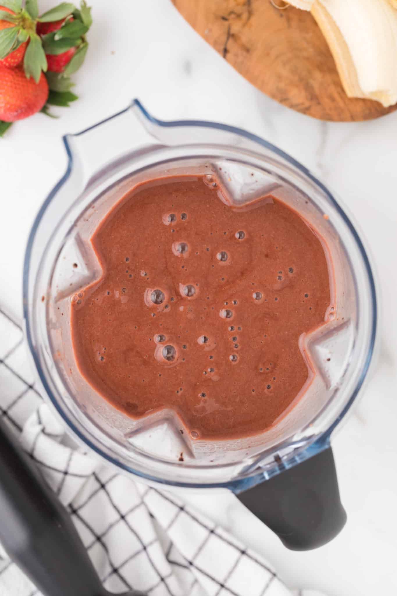 blended strawberry banana chocolate smoothie in vitamix.