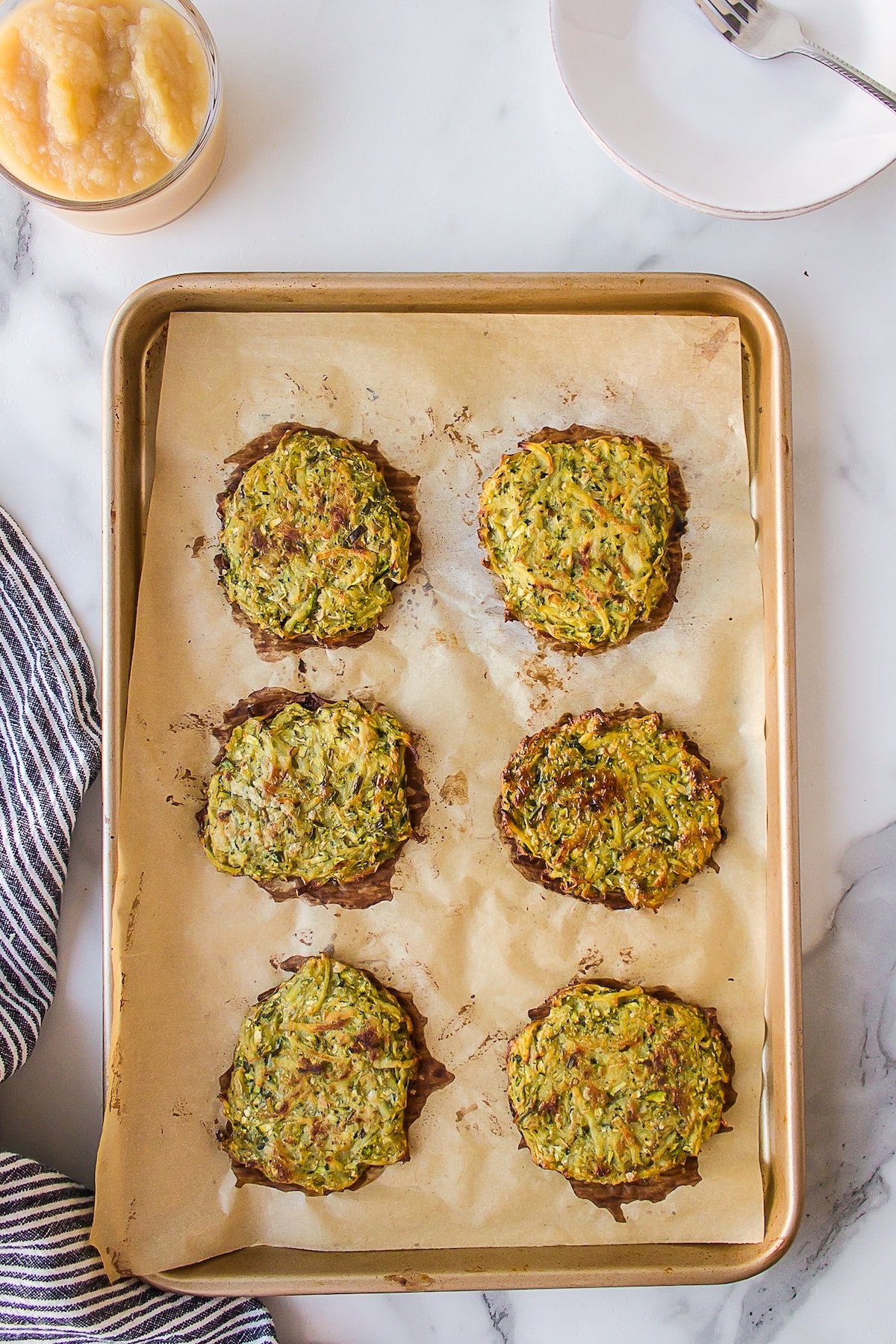 making zucchini potato fritters baked in oven.