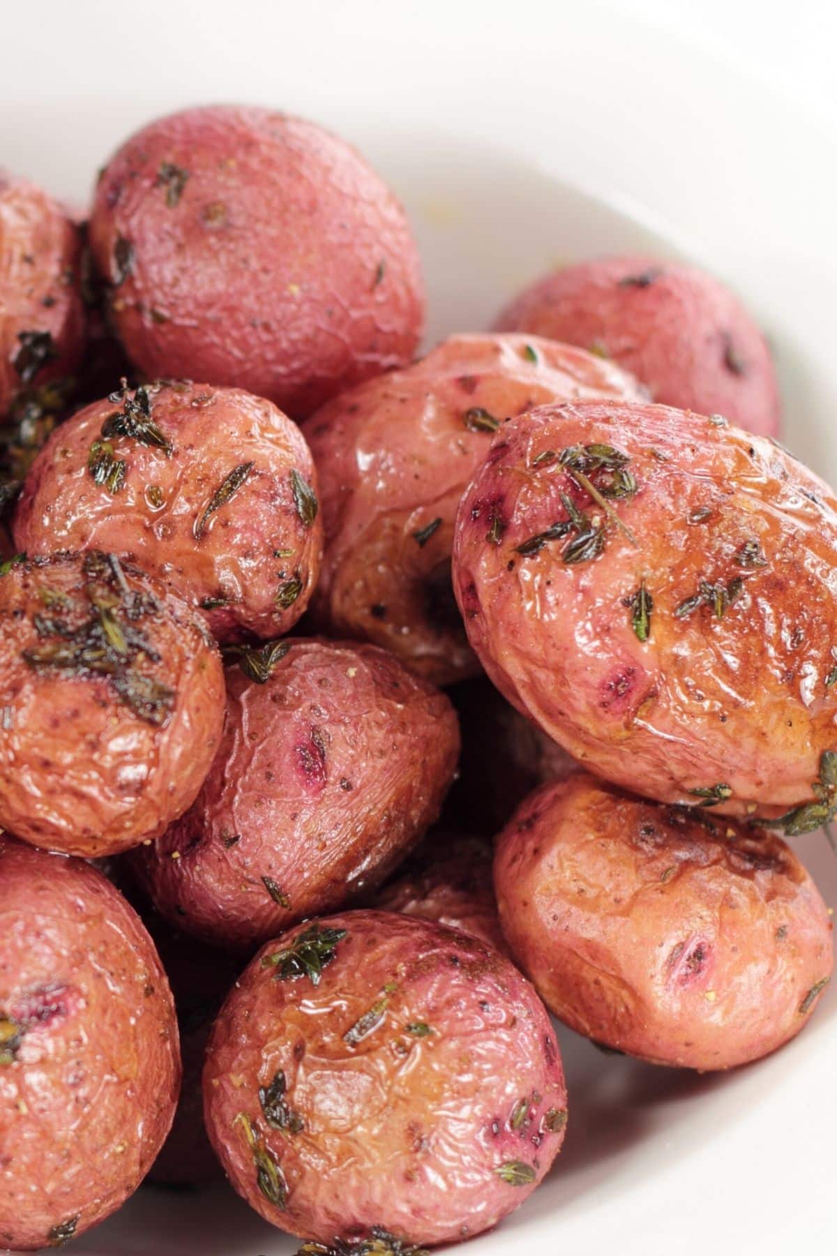 bowl of whole roasted air fryer red baby potatoes.
