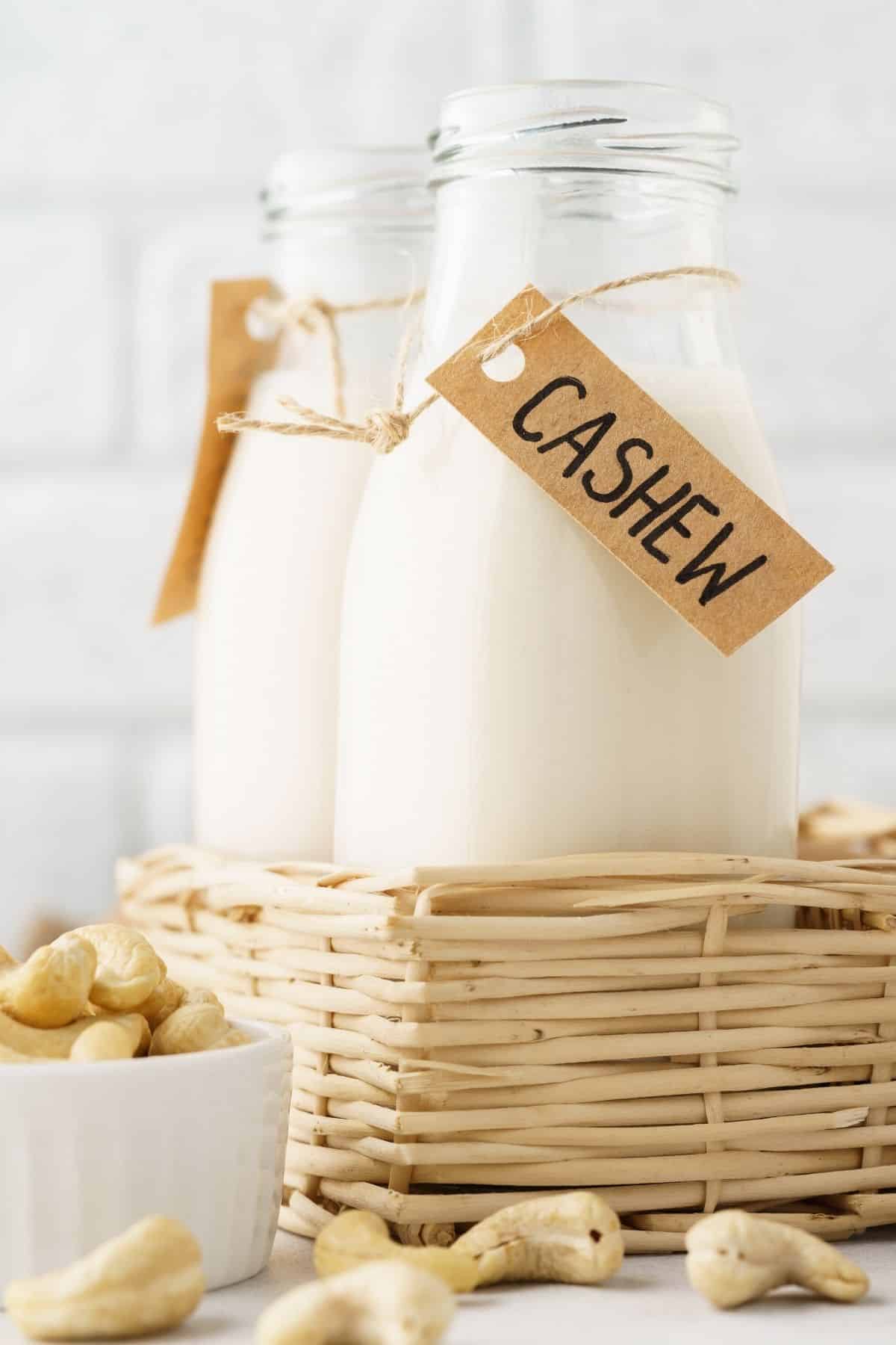 two jars of cashew milk with label that says cashew milk.