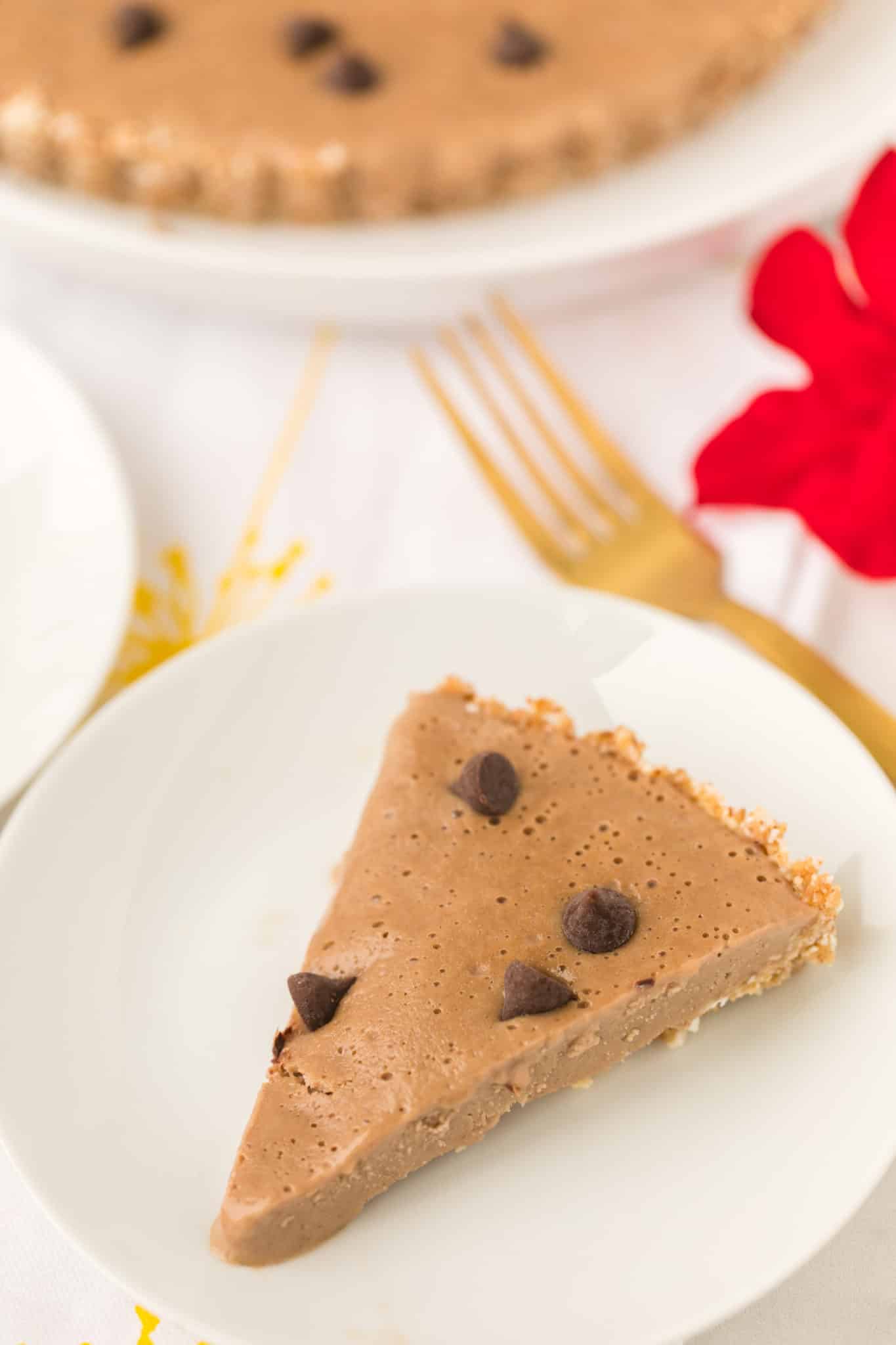 slice of vegan peanut butter pie served on plate with fork.