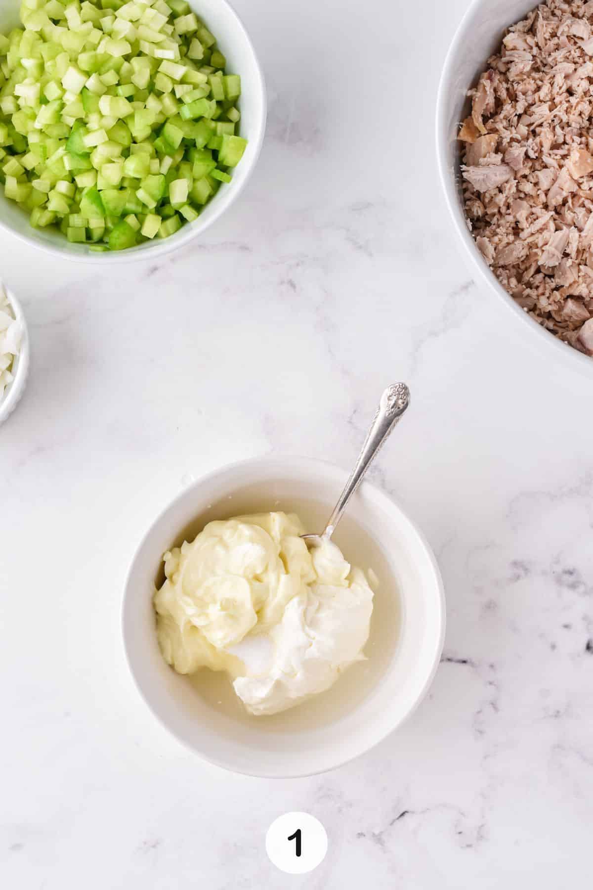 ingredients for costco chicken salad dressing in bowl.