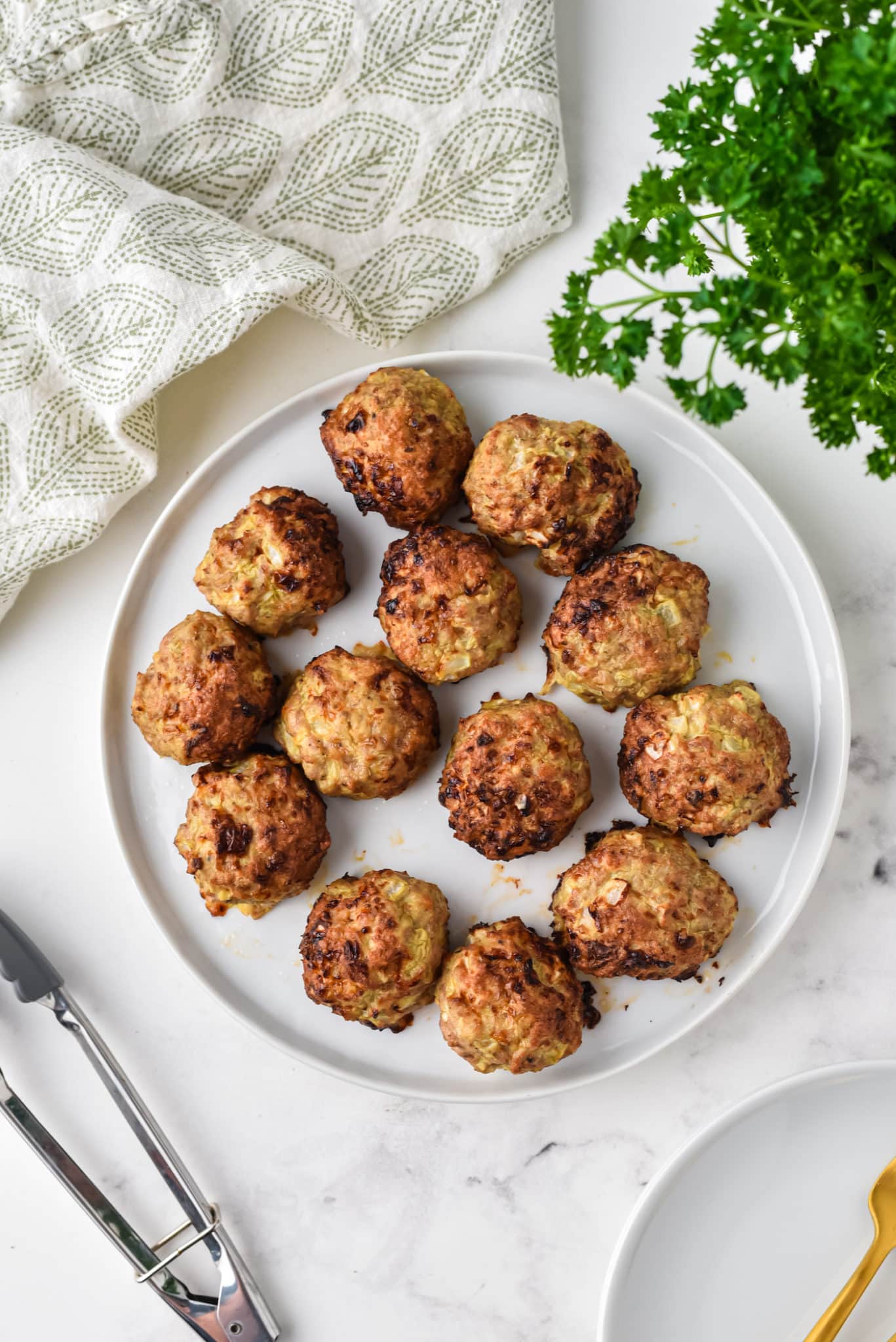 plate of cooked turkey meatballs.