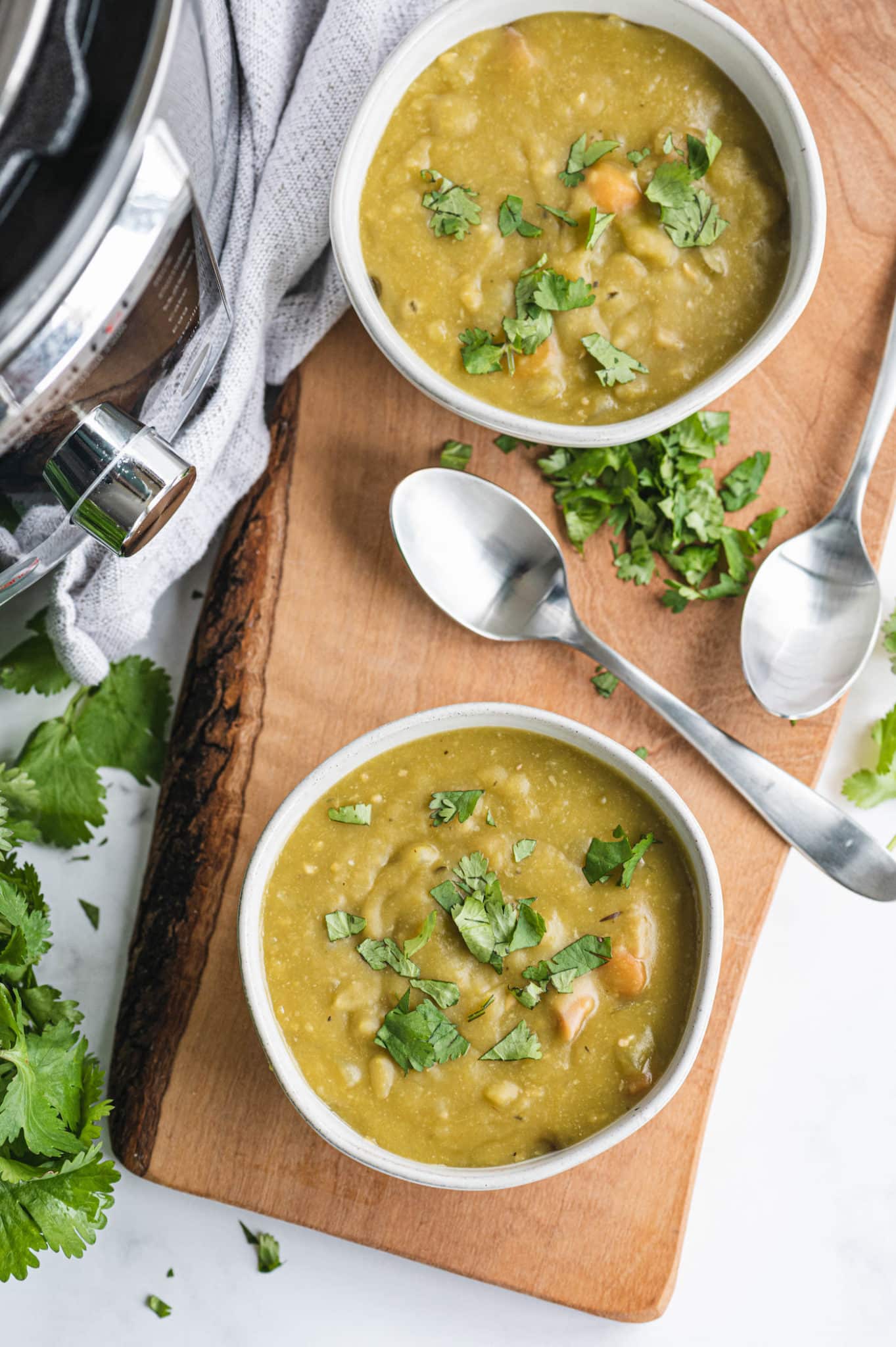 two bowls of instant pot split pea soup ready to eat.