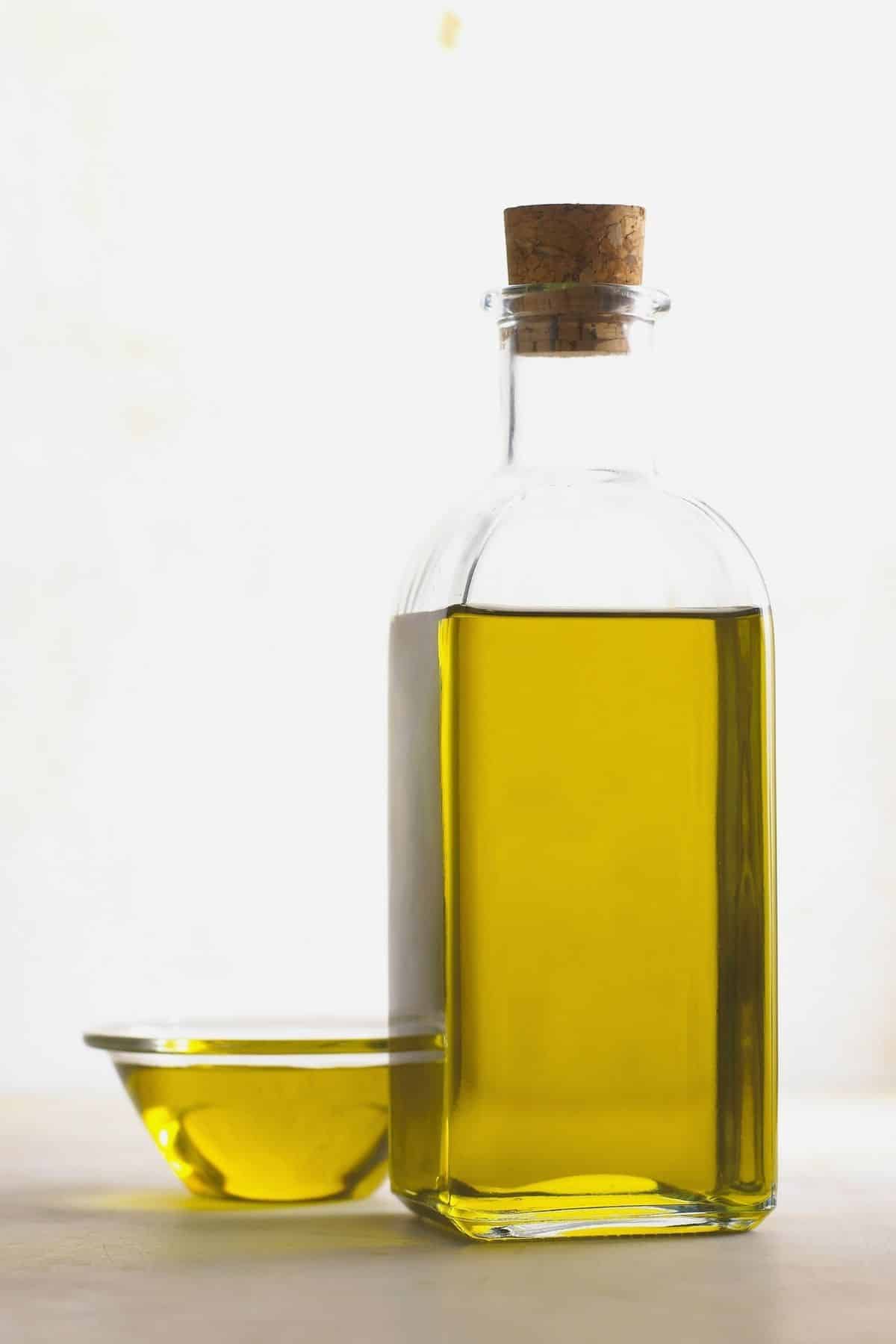 Jar of olive oil on the counter.
