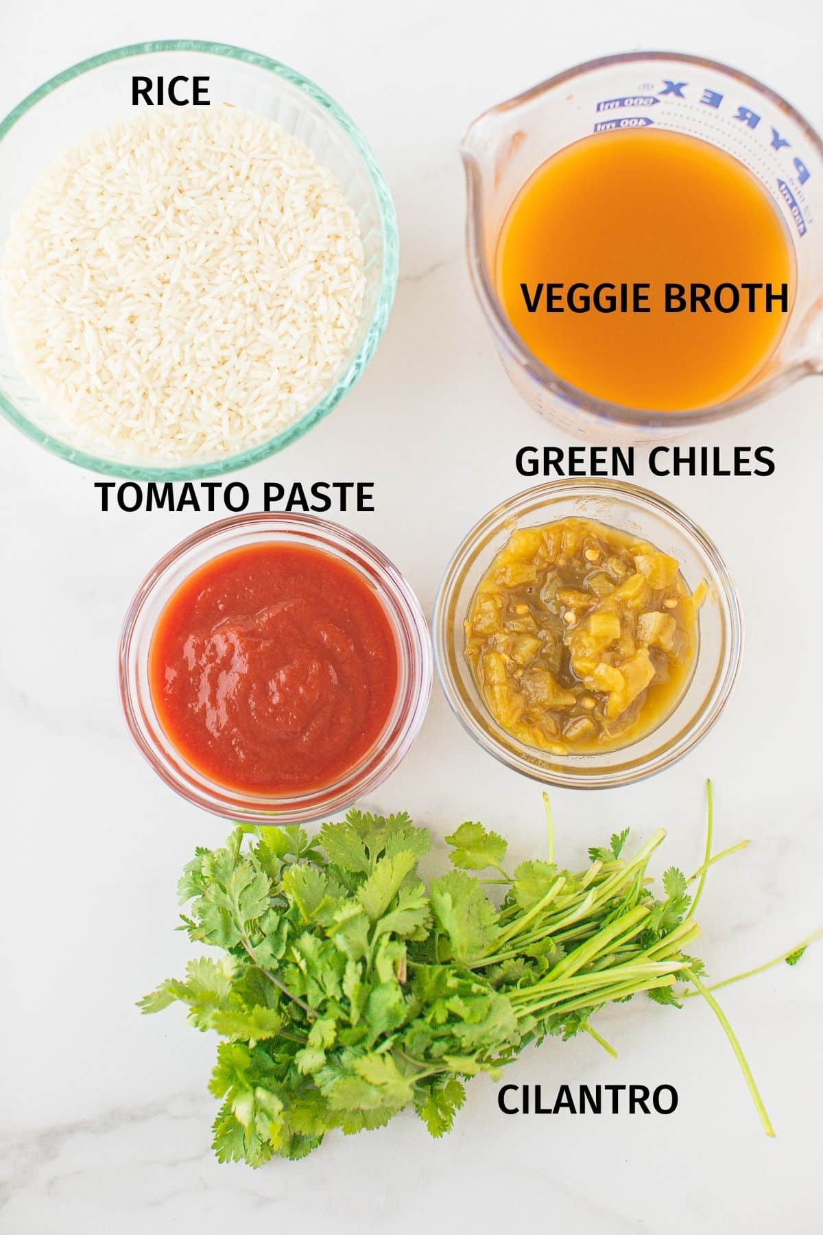 Labeled photo with ingredients for instant pot mexican rice.