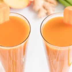 Two glasses of fresh made carrot celery juice.