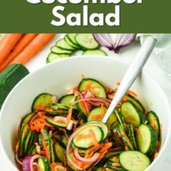 A forkful of cucumber carrot salad over the serving bowl.