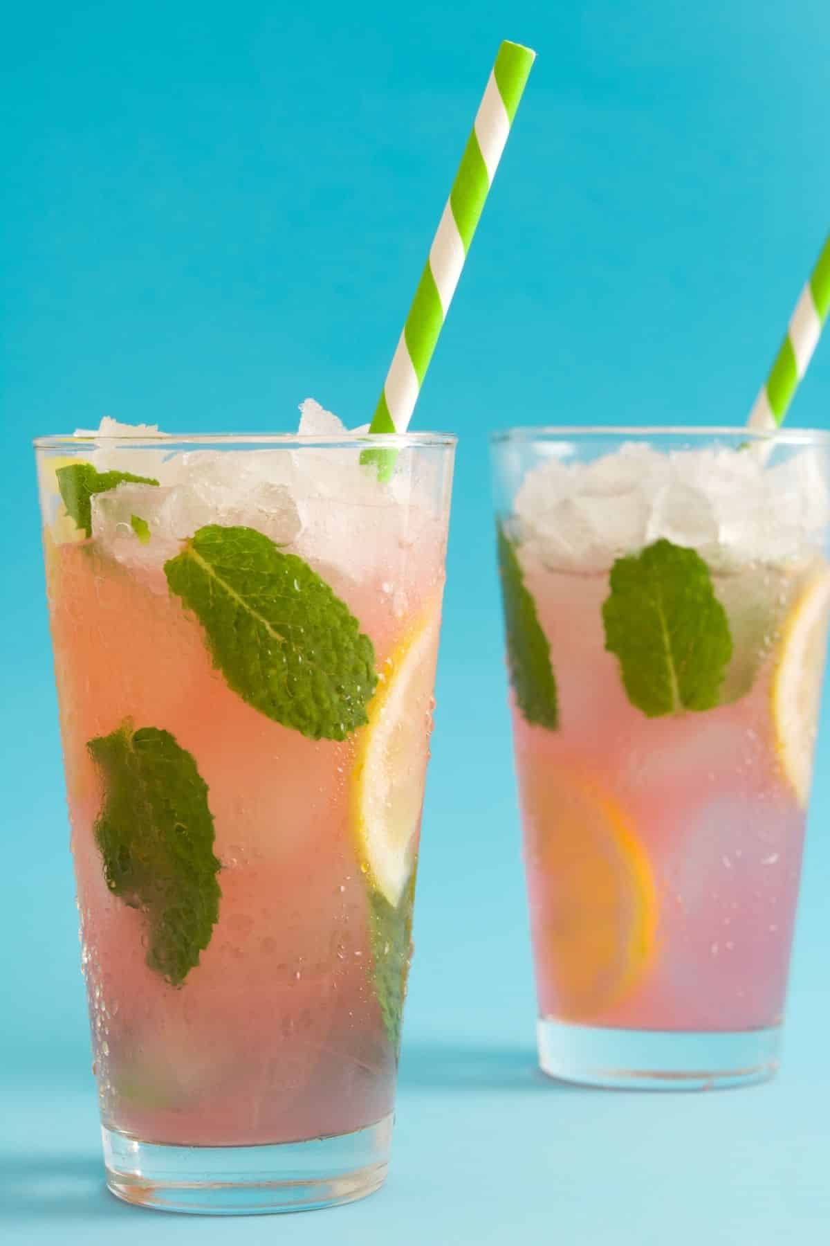 two glasses of kombucha lemonade with fresh mint.