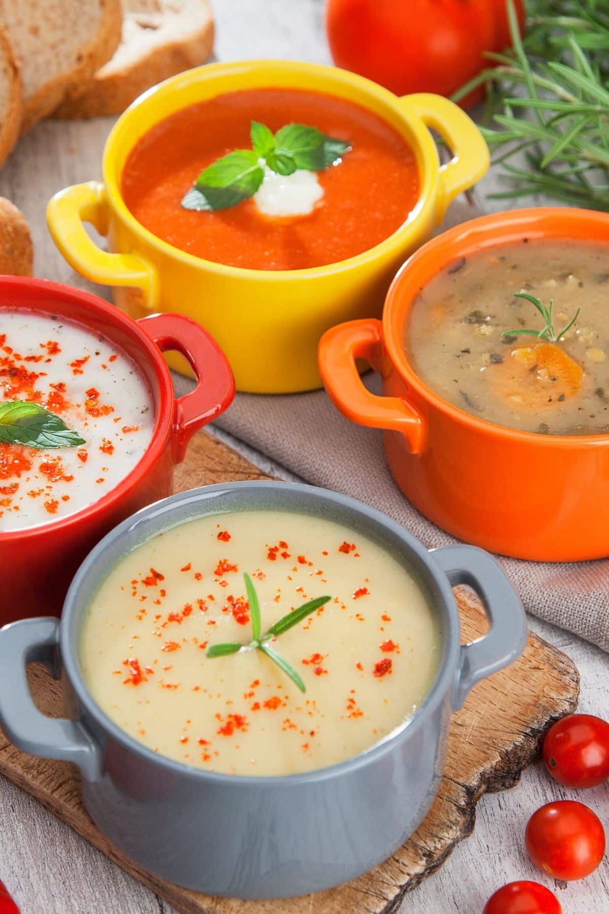 three instant pot soups on a table with veggies.