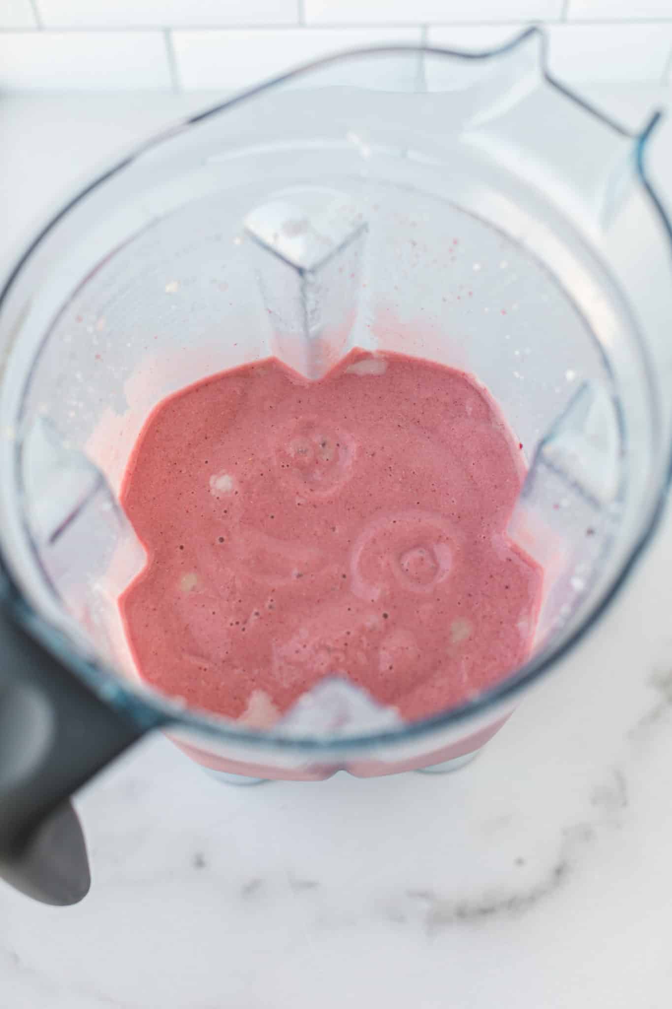 blended strawberry ice cream base in blender.