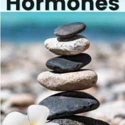 A stack of balanced rocks on a beach to represent balanced hormones.
