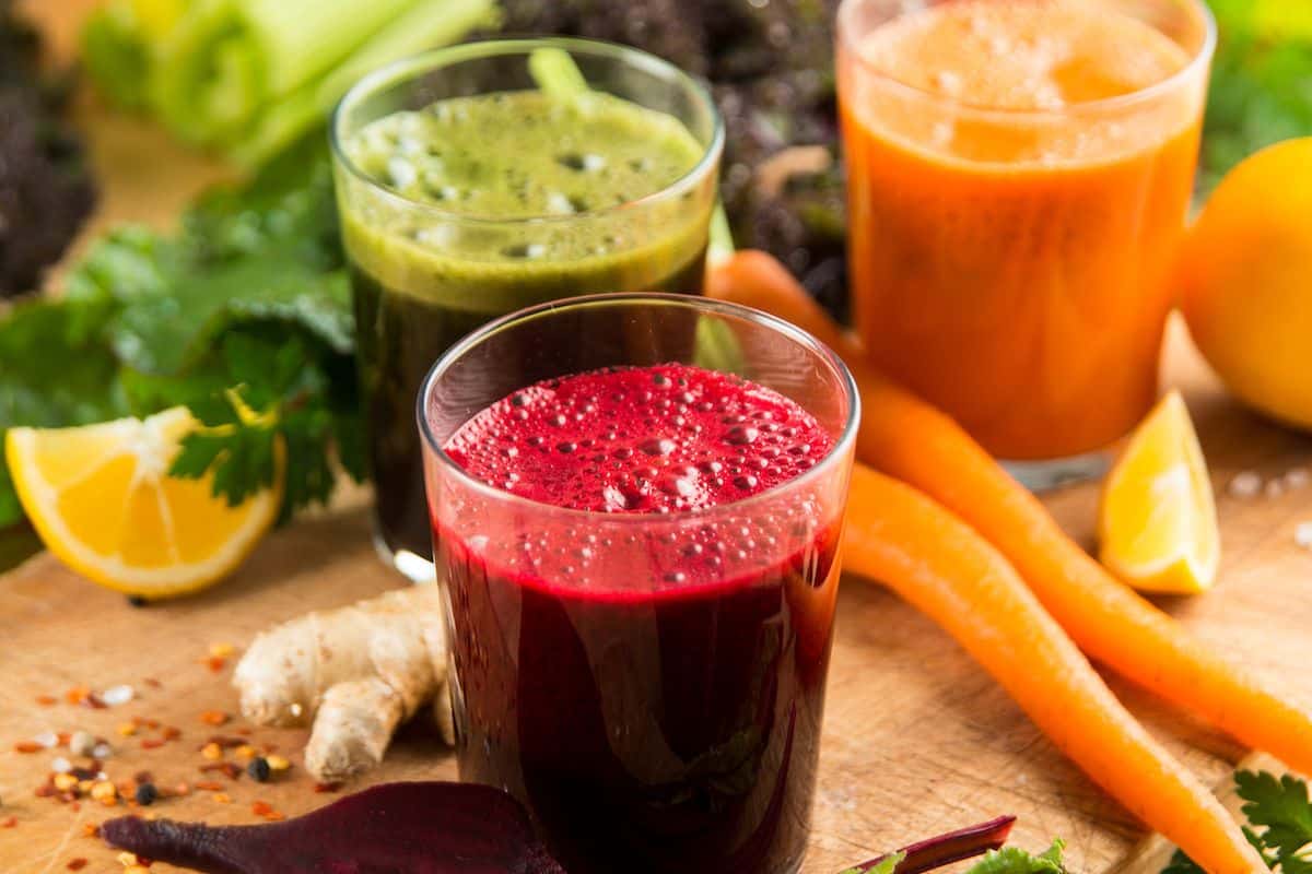 https://www.cleaneatingkitchen.com/wp-content/uploads/2022/06/three-colorful-juice-cleanse-recipes-on-table.jpg