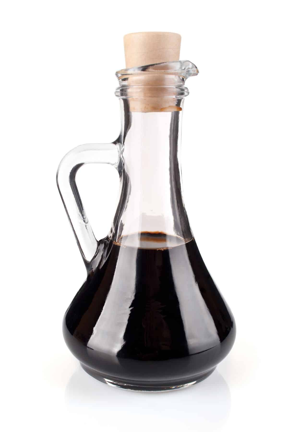 Bottle of balsamic vinegar with corked top.