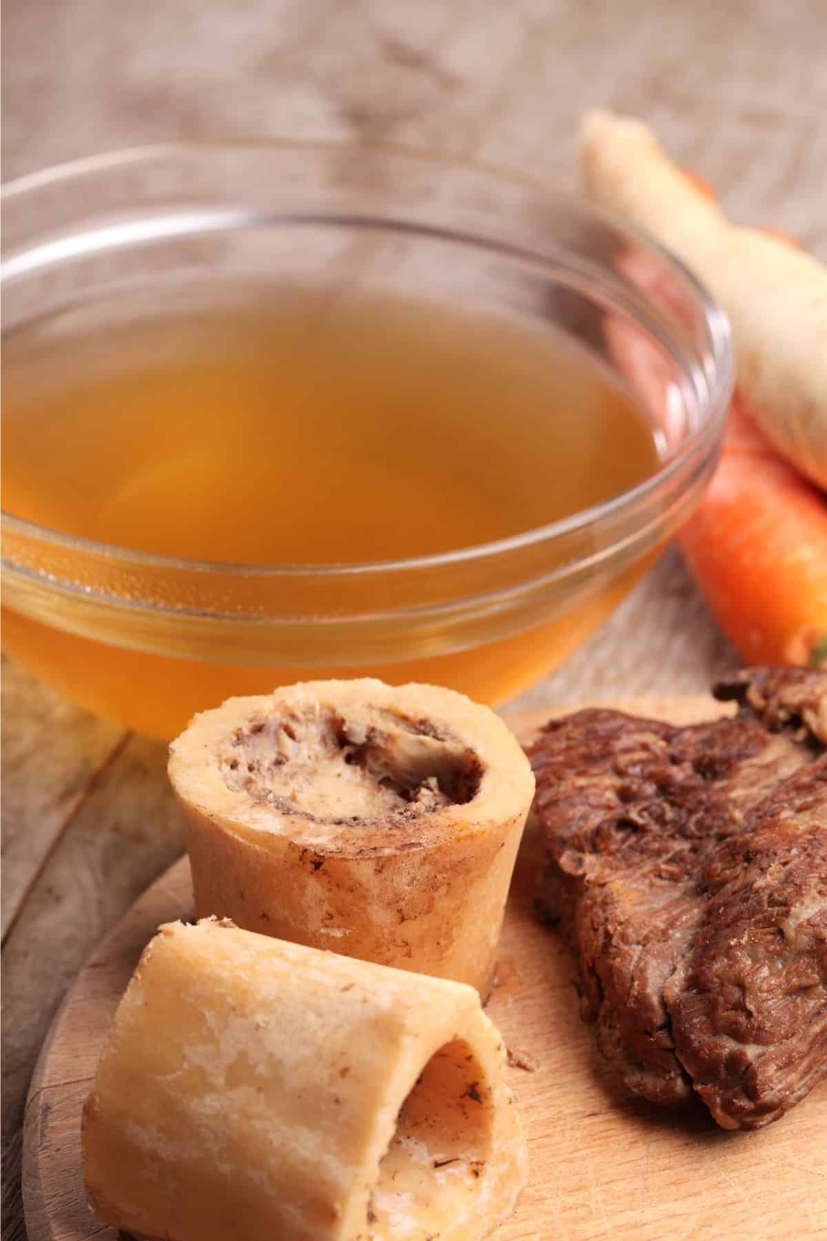 Beef broth with beef bones and meat.