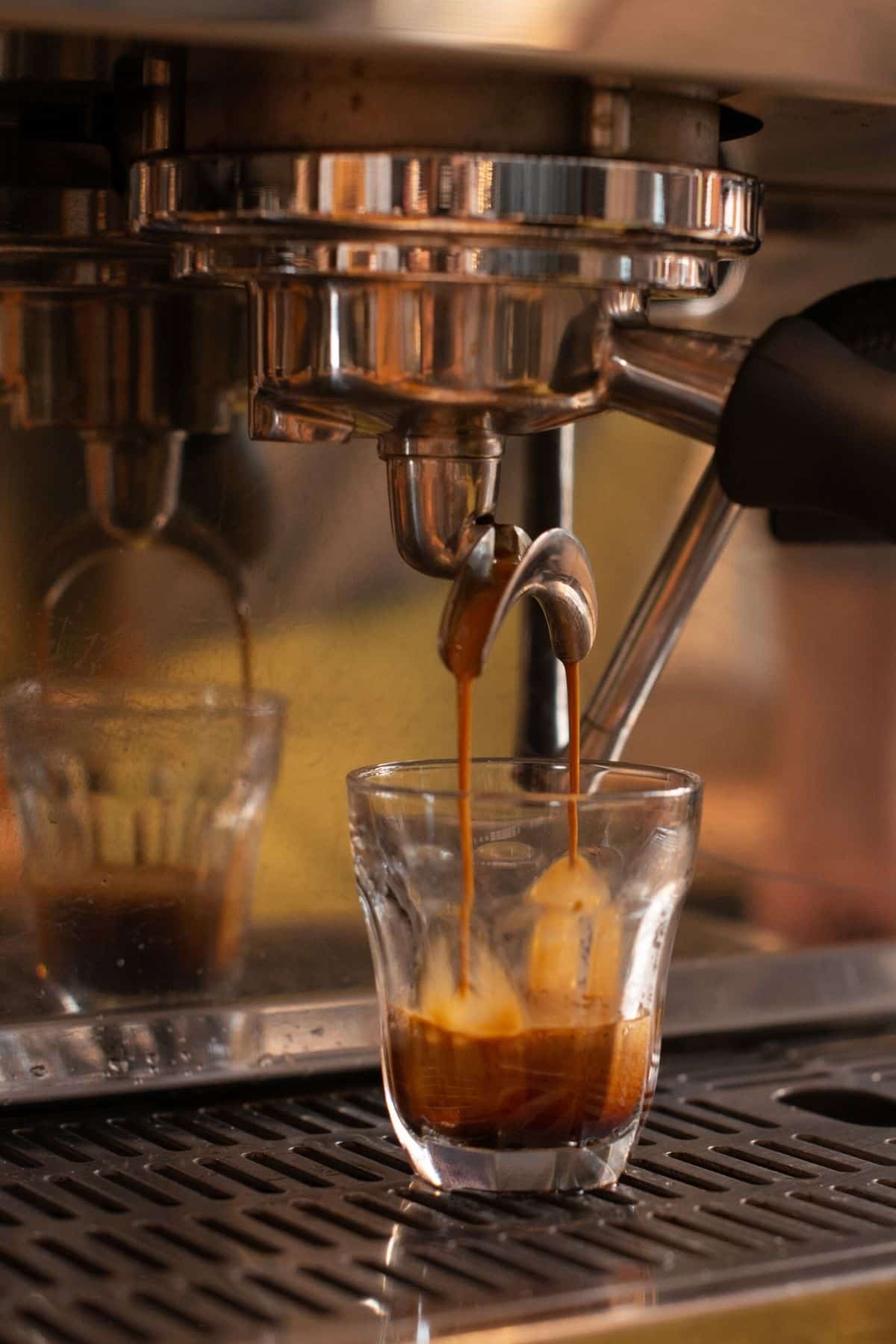 brewing espresso from a machine.