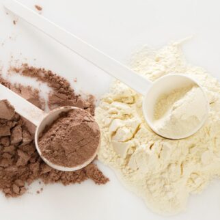 chocolate and vanilla protein powder on a tabletop.