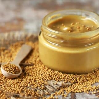 Jar of Dijon Mustard with mustard seeds.
