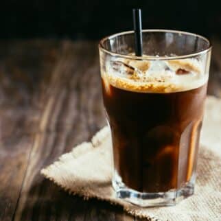 espresso americano over ice with straw.