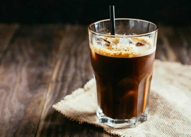 espresso americano over ice with straw.