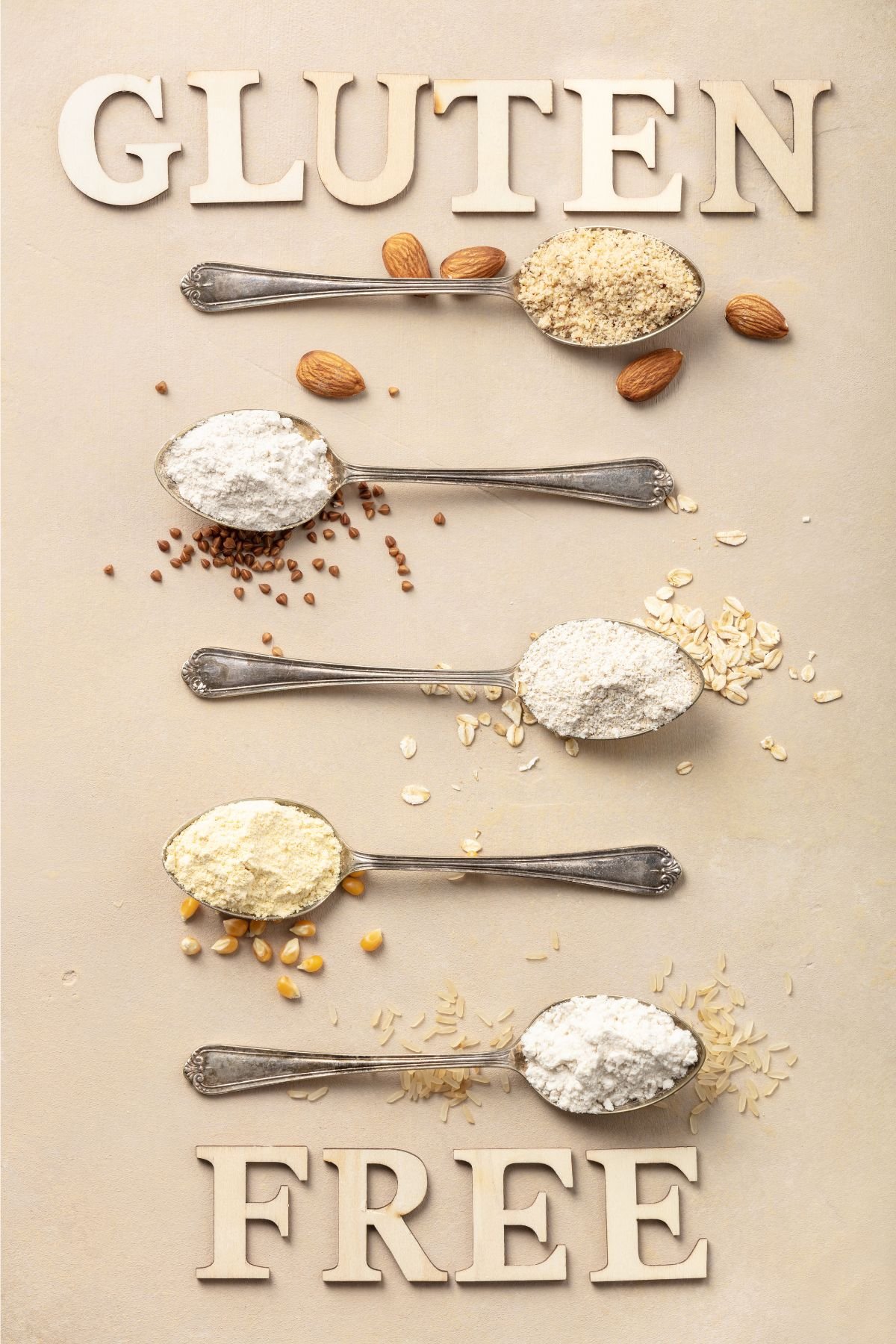 Gluten free flours on spoons placed horizontal.