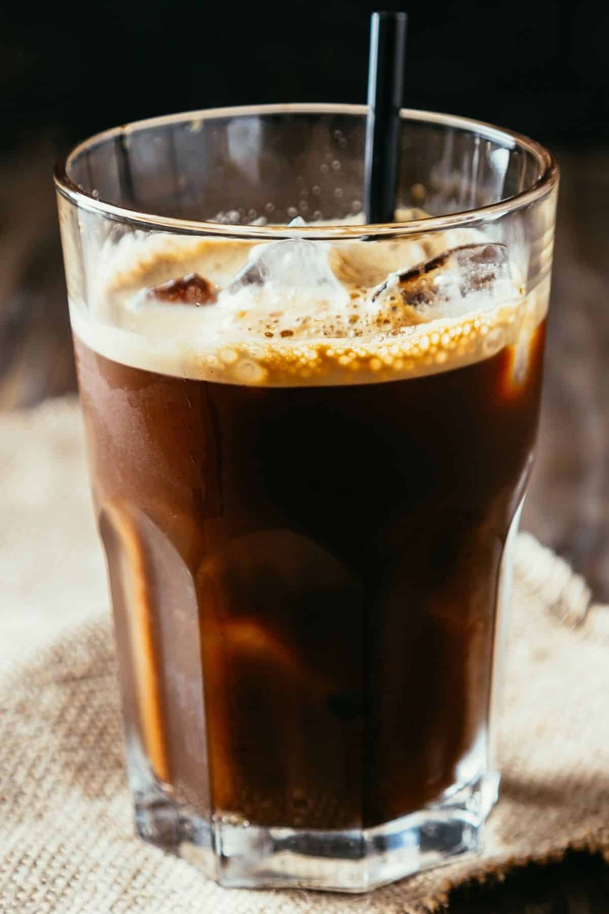 iced espresso in a glass with crema.