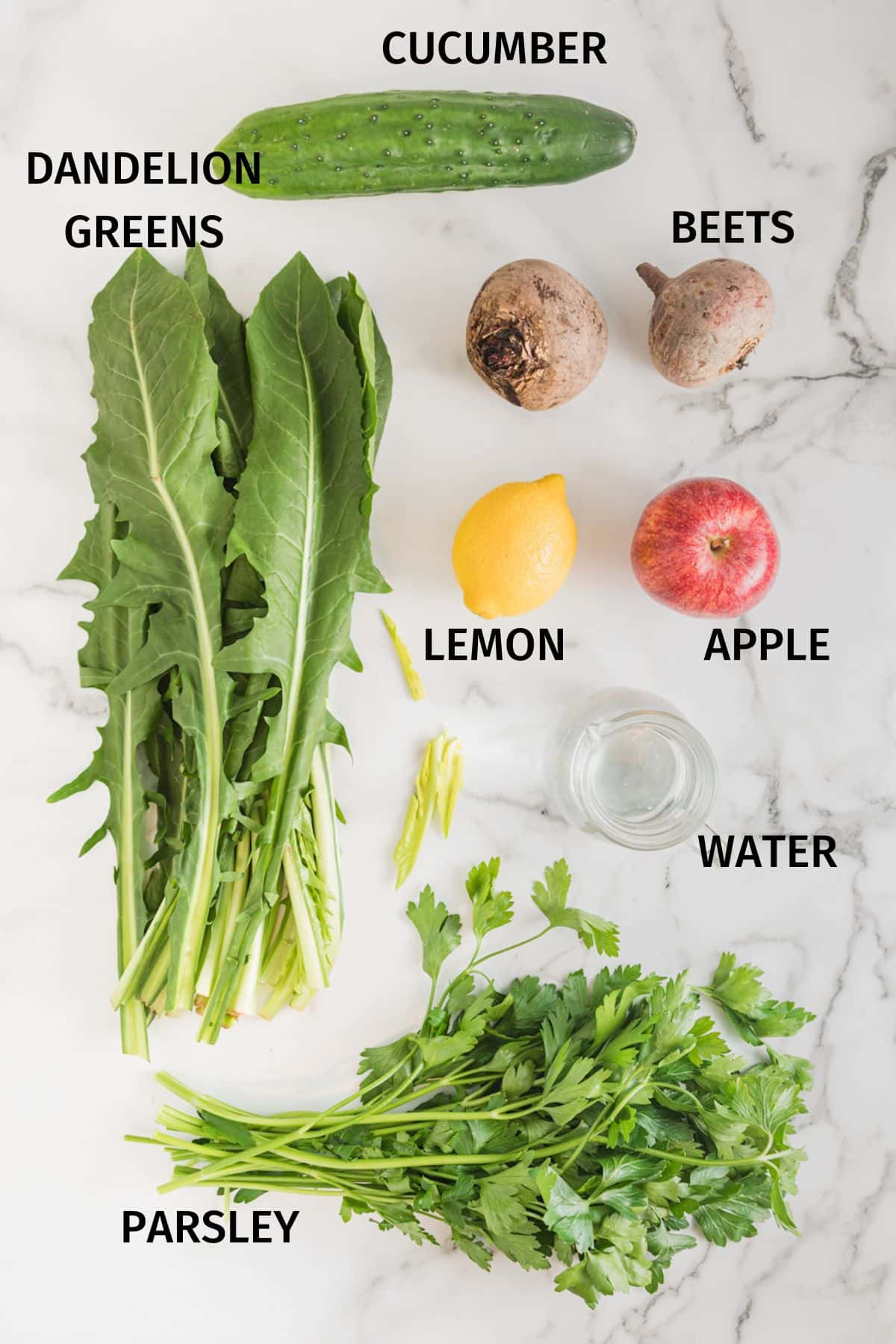 Ingredients for liver cleanse juice laid out on a white surface.