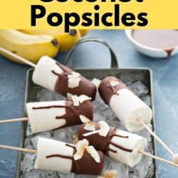 Banana popsicles covered in chocolate sitting in a pan with ice with text.