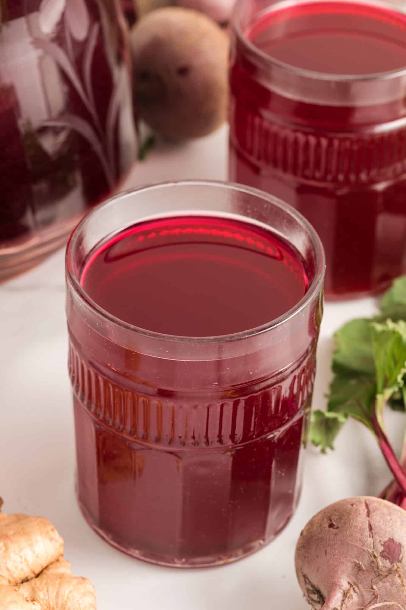 glass of beet juice on table.