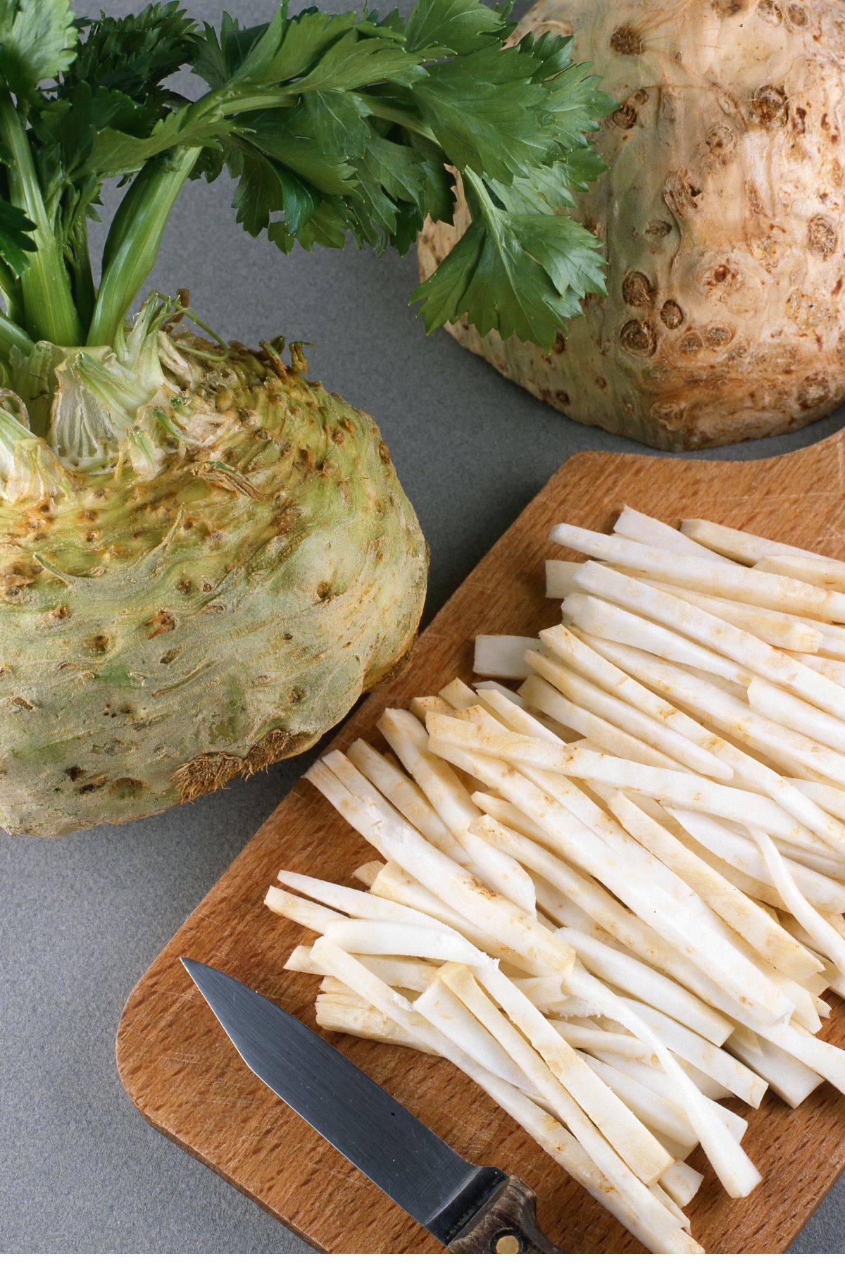 celeriac sliced on cutting board.