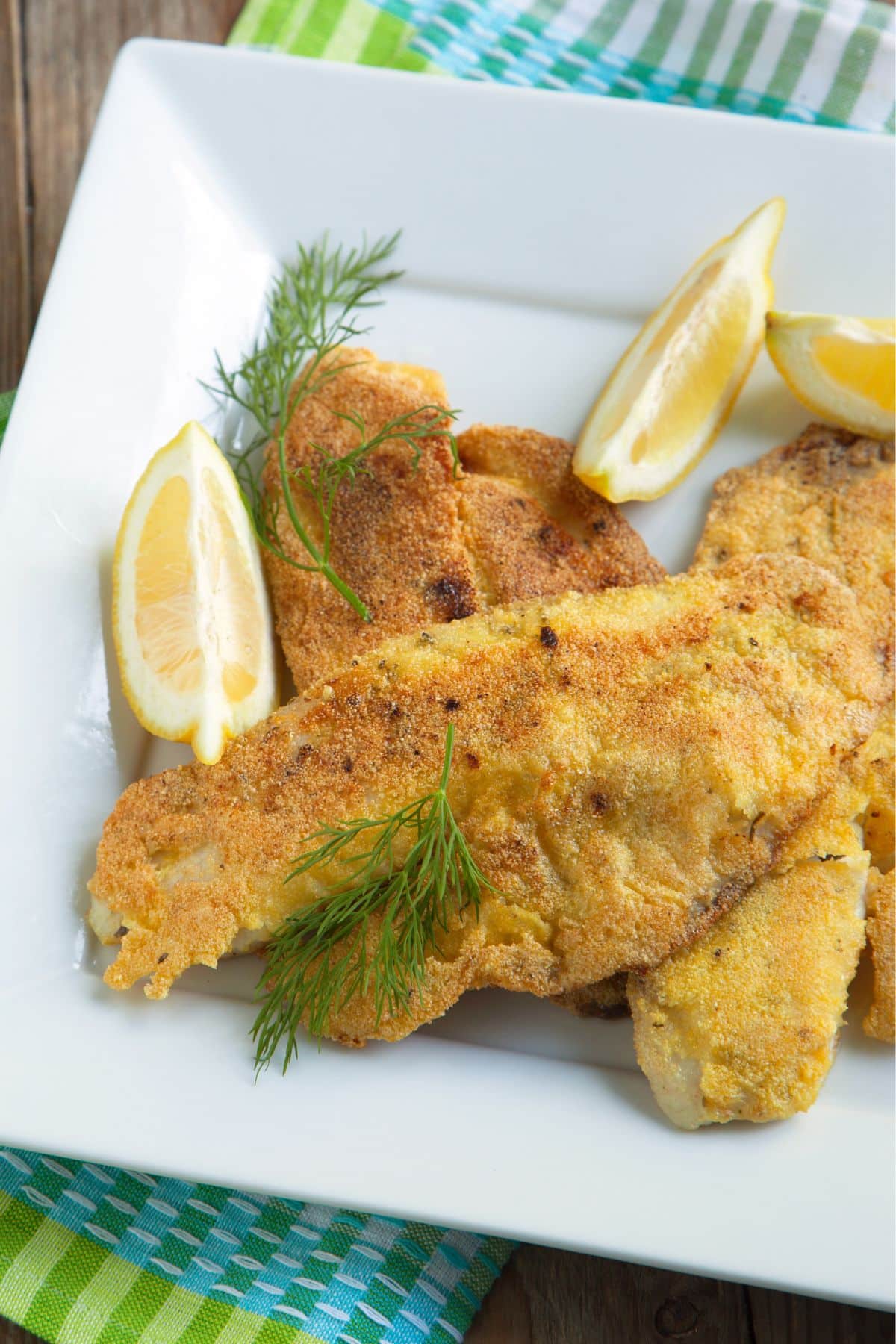 Fried fish in cornmeal batter with lemon and dill.