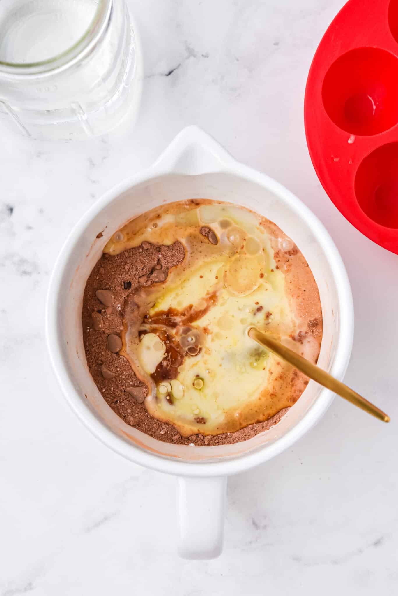 wet and dry ingredients for instant pot brownie bites in bowl.