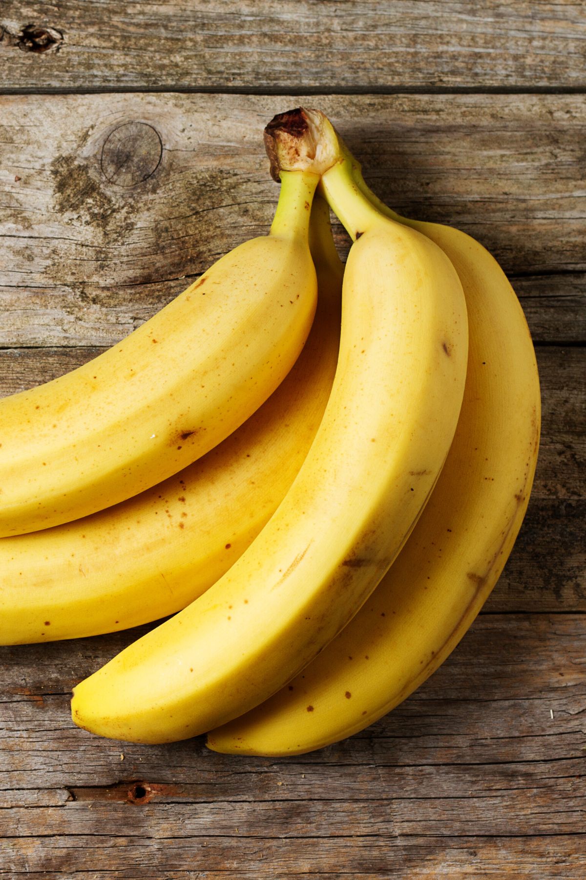 A bunch of bananas on a table.