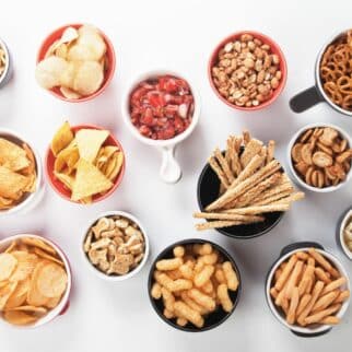 snacks in various containers on table.