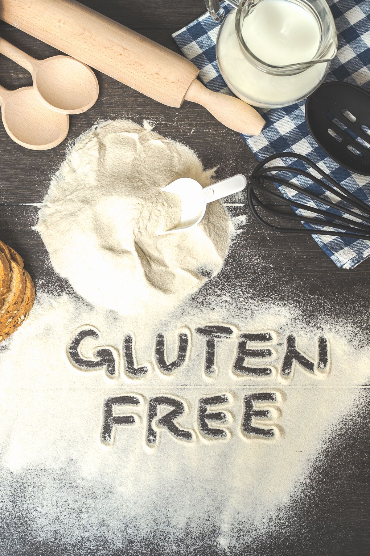 Gluten free spelled in gluten free flour on wooden surface.