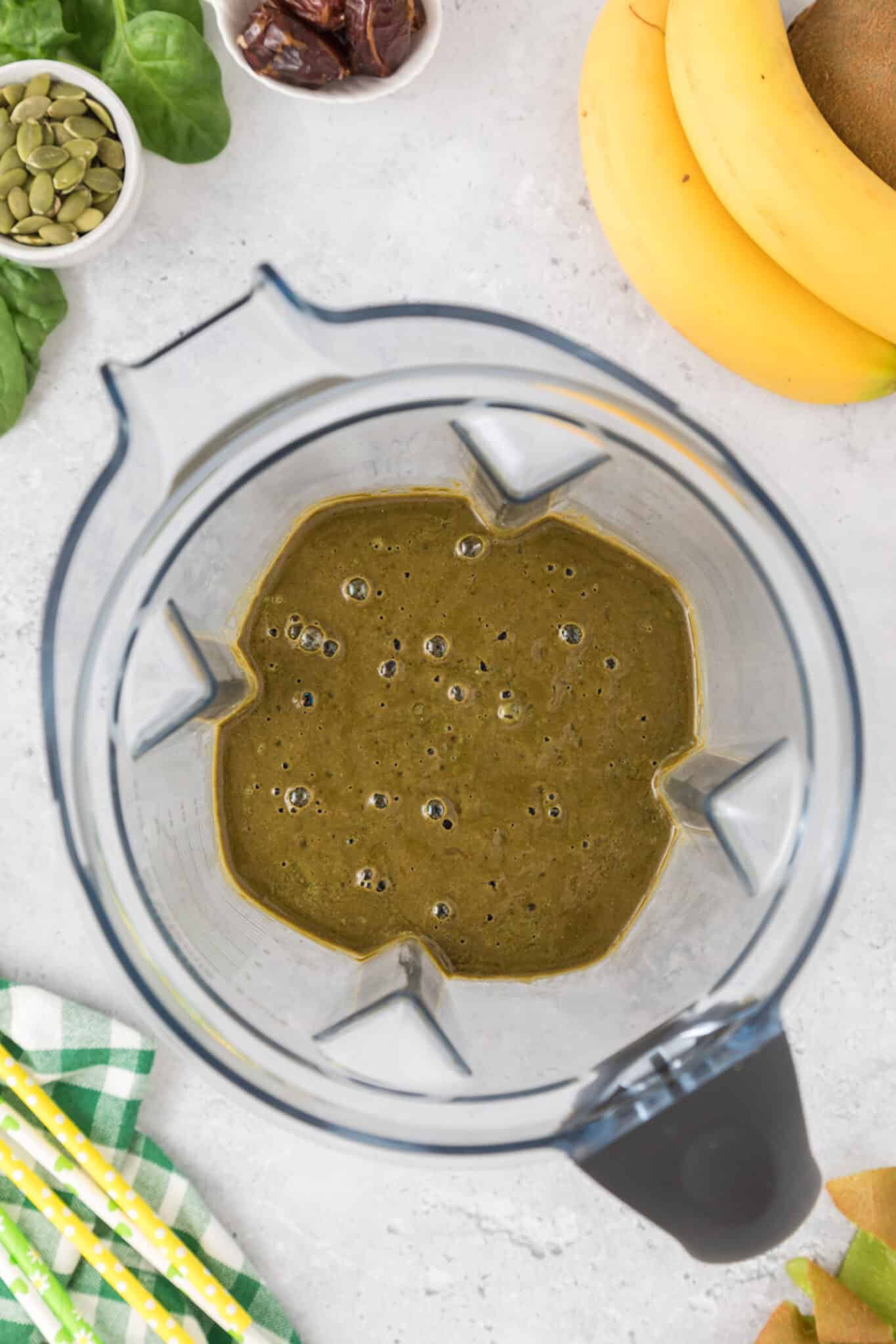 Blended iron rich green smoothie in the jar of a blender.