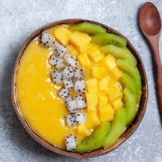 Smoothie bowl with mango, kiwi, and dragon fruit.