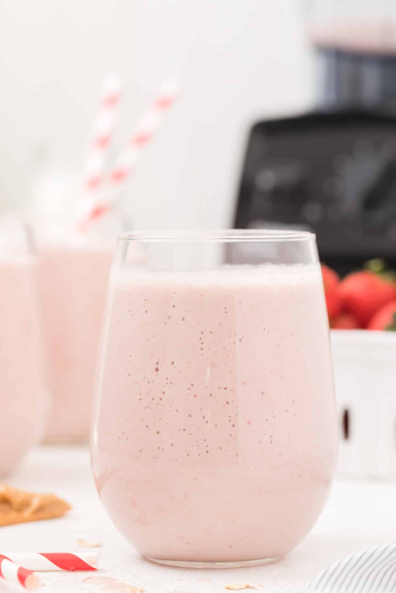 Strawberry beef protein smoothie in a glass.