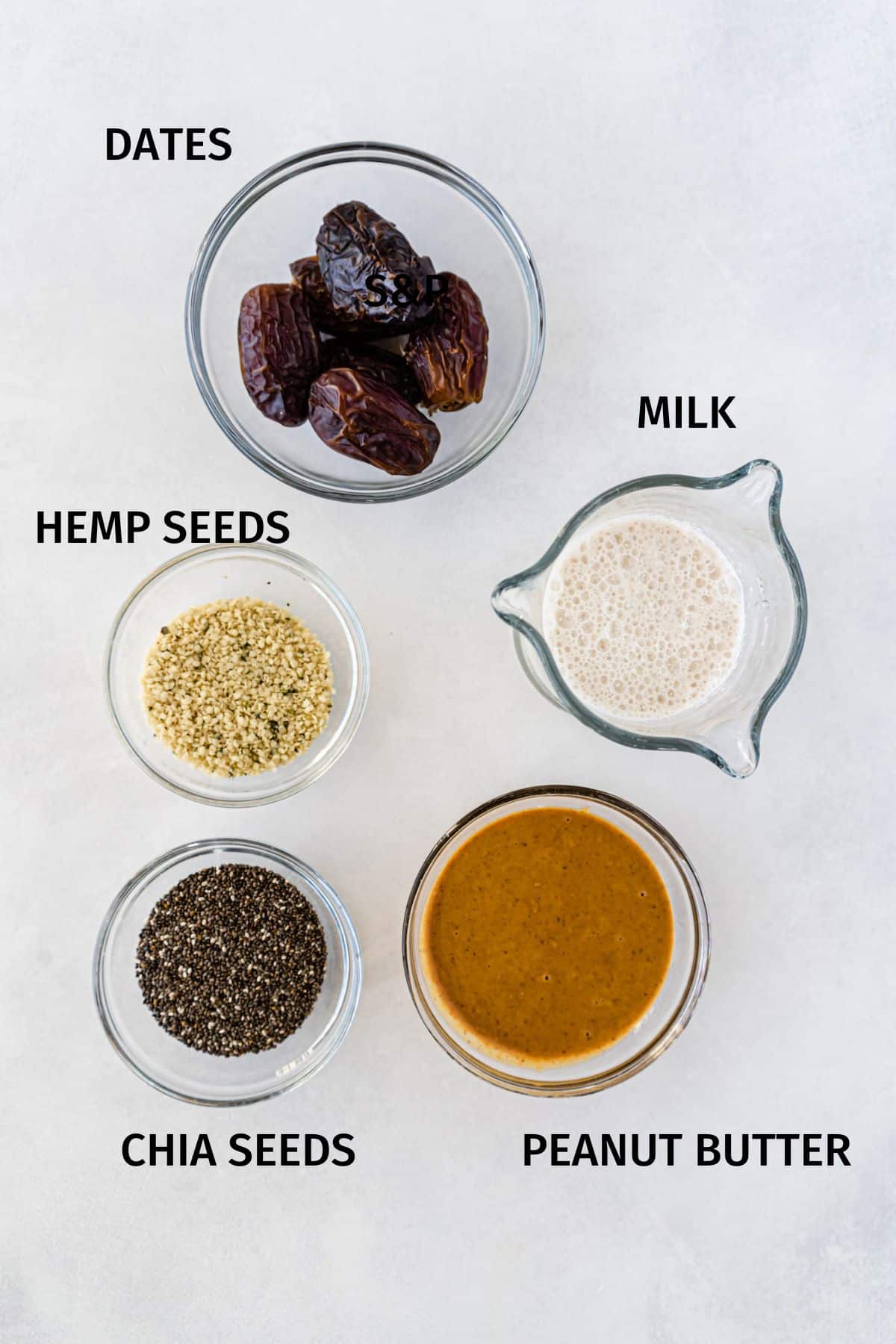 Ingredients to make peanut butter chia seed pudding in small bowls.