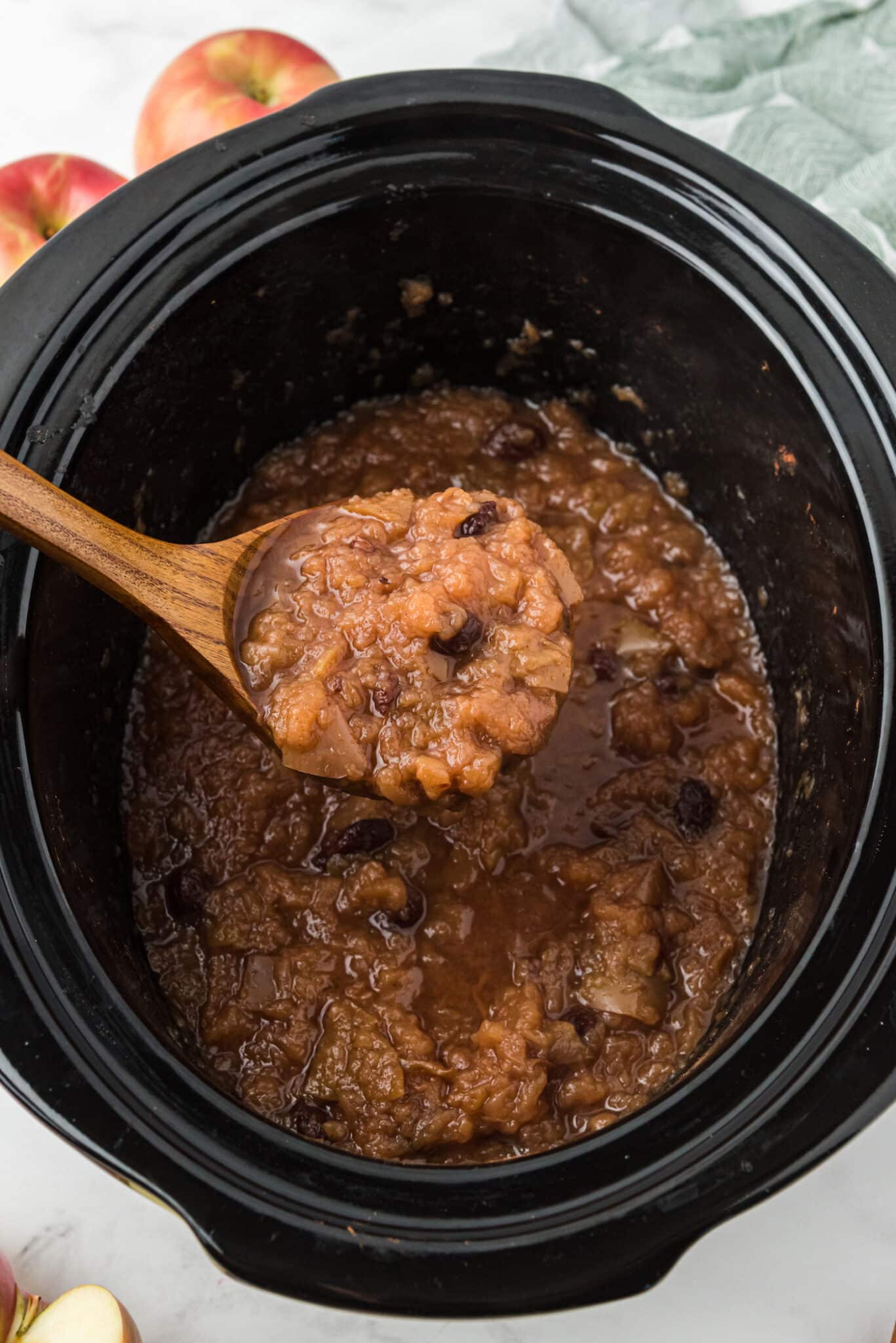 cooked applesauce in the crockpot ready to serve.